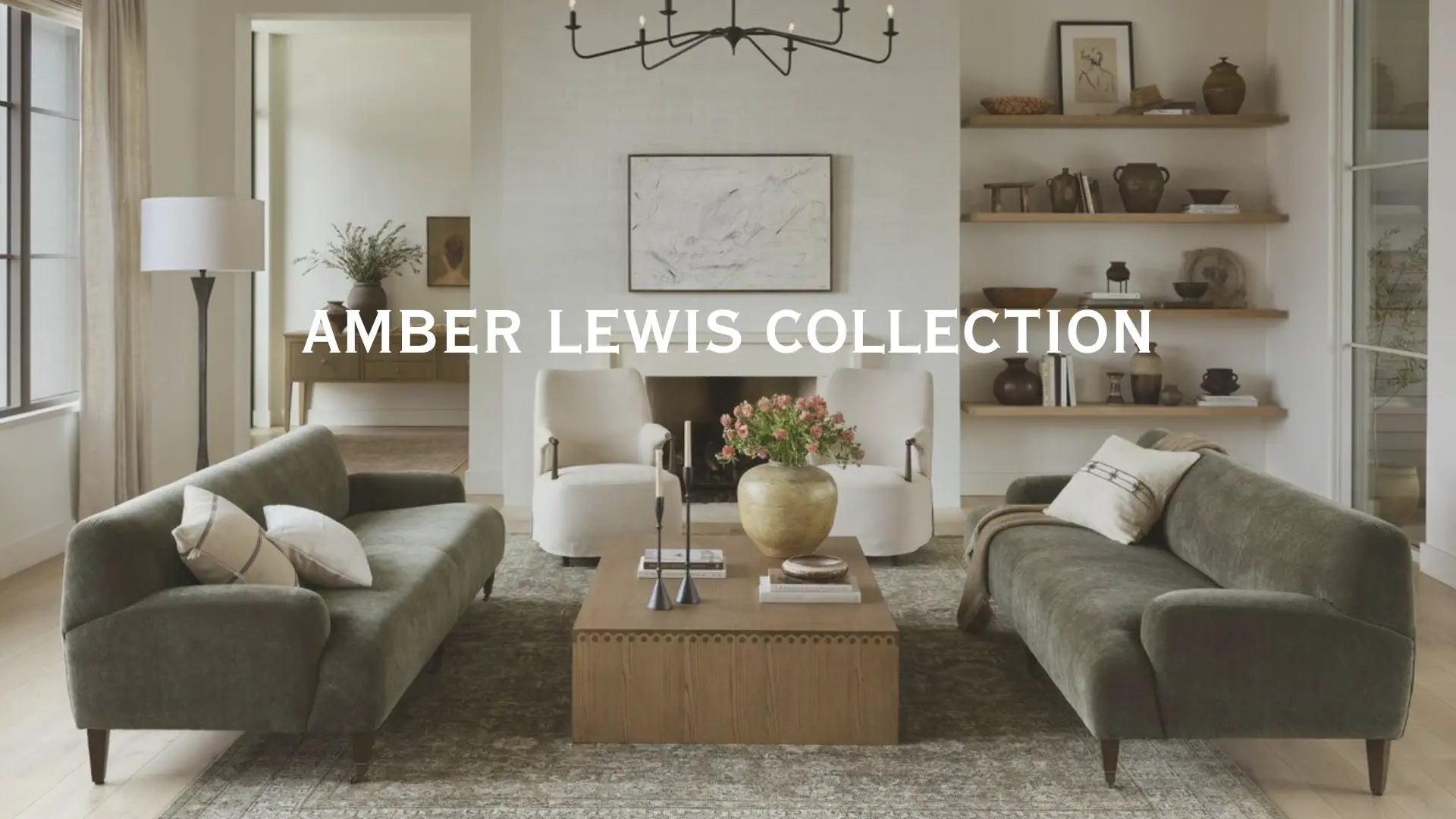 Living room with furniture and decor, featuring the Amber Lewis Collection logo.